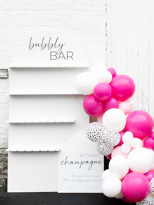 white and tan bubbly bar champagne wall