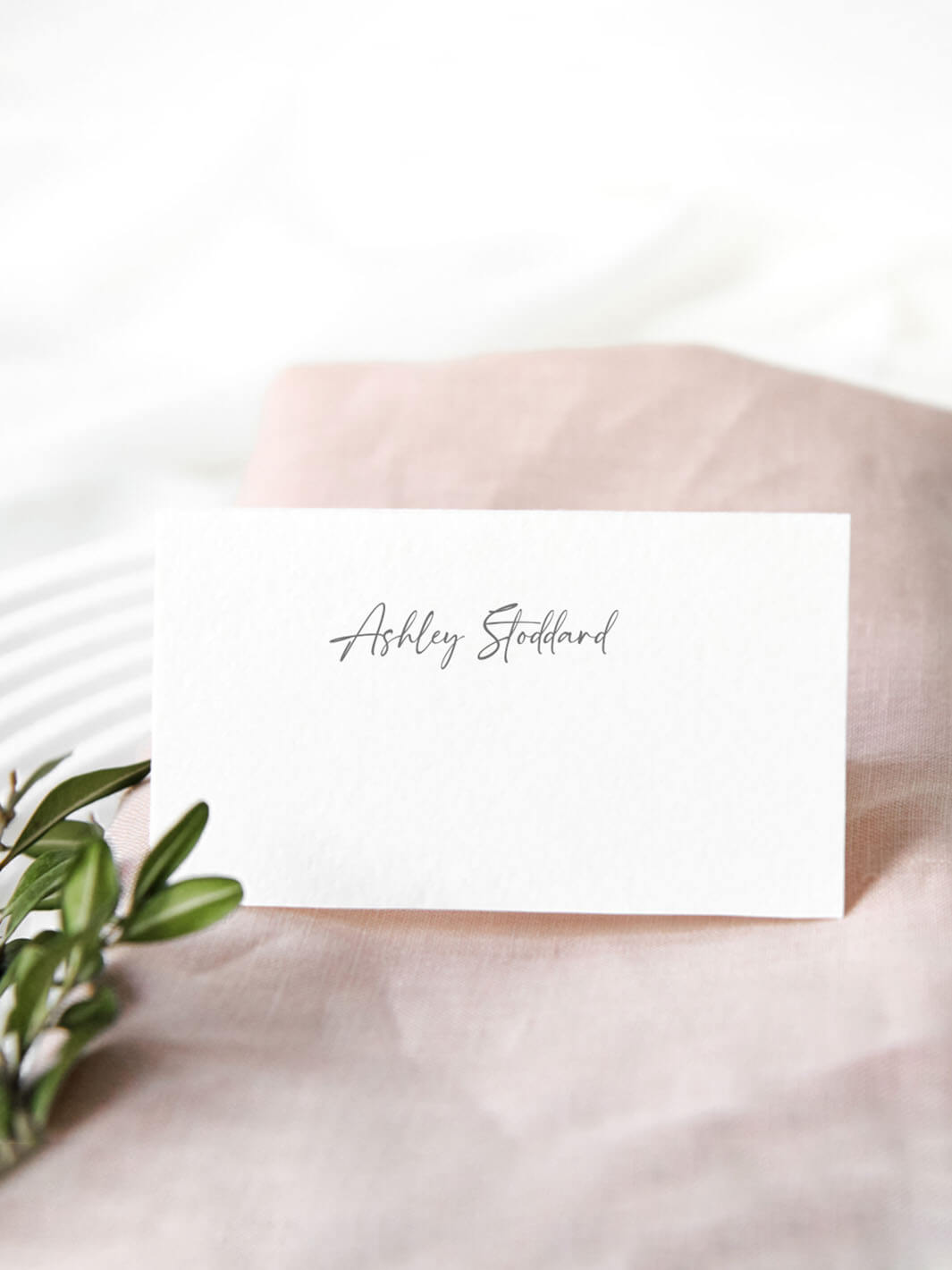 escort card with gray script text